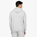 Back view of a man wearing a light gray hoodie with a plain design and a hood, paired with matching light gray jogger-style sweatpants. The outfit is displayed against a plain white background." Let me know if you'd like any adjustments