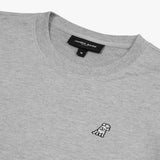 Close-up of the neckline and embroidered dog logo on the gray sweatshirt, highlighting the fine details and texture