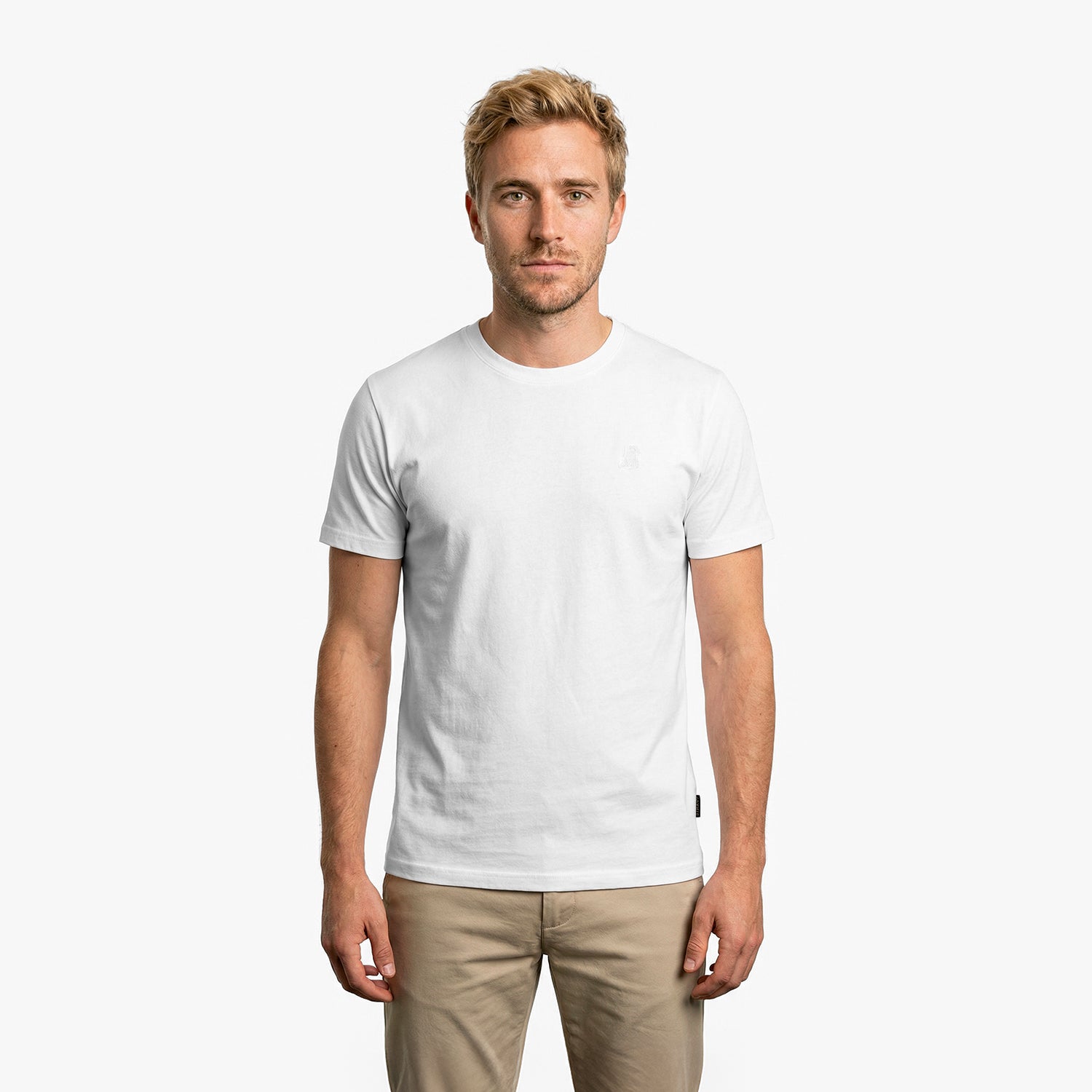 Man wearing a plain white t-shirt on a white background