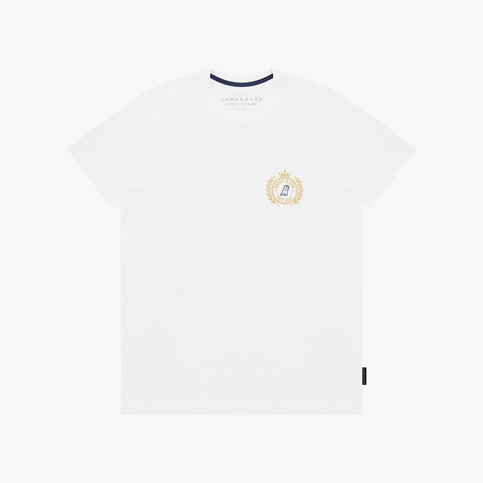 A white T-shirt with a small gold and blue crest graphic on the left chest, displayed flat