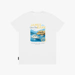 A white T-shirt with a colorful graphic print featuring a yacht, a coastal castle, and the text 'JAMES BARK Yacht Club' and 'LUXURY BY THE COAST'.