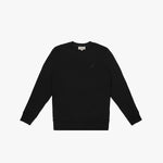 A black crewneck sweatshirt laid flat on a white background. It features long sleeves, ribbed cuffs, and a ribbed hem. A subtle embroidered logo, matching the black fabric, is positioned on the left chest area. The neckline includes a white label with black text displaying the brand "JAMES BARK." The fabric appears soft and comfortable.