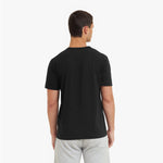 Man wearing a black t-shirt on a white background