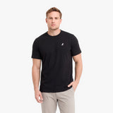 A man wearing a black short-sleeve crewneck t-shirt with a small white embroidered logo.