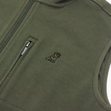 A close-up shot of the chest pocket zipper and small embroidered logo.