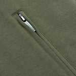  A detailed close-up of a zippered pocket on the vest.