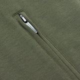  A detailed close-up of a zippered pocket on the vest.