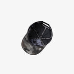 A black baseball cap with a gray camouflage pattern on the brim and a black dotted pattern on the back panels