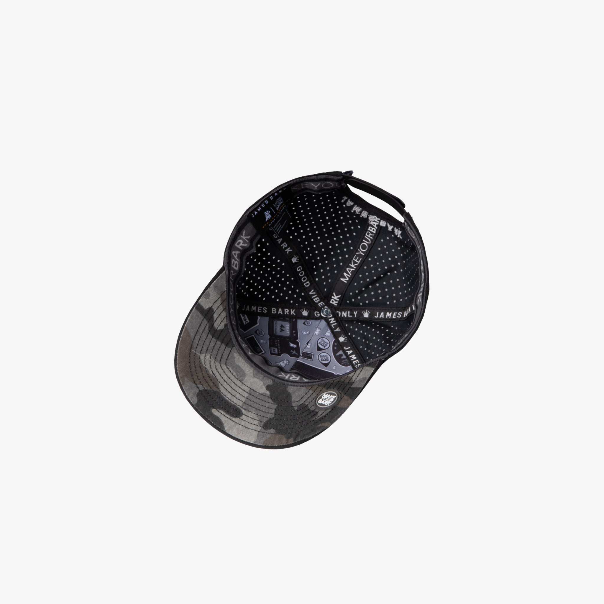 A black baseball cap with a gray camouflage pattern on the brim and a black dotted pattern on the back panels