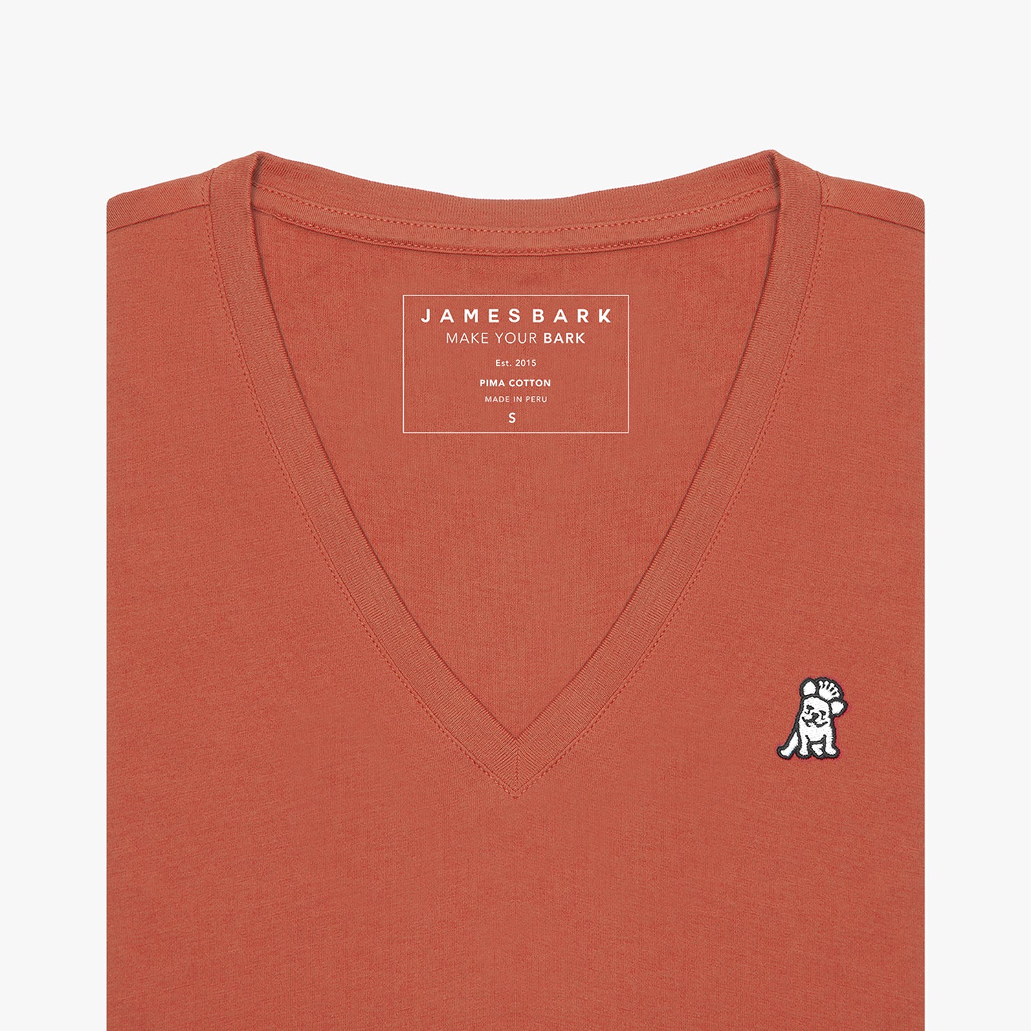 Front view of a terracotta-colored women's V-neck t-shirt laid flat against a white background, showing the short sleeves and the black and white embroidered logo on the left chest