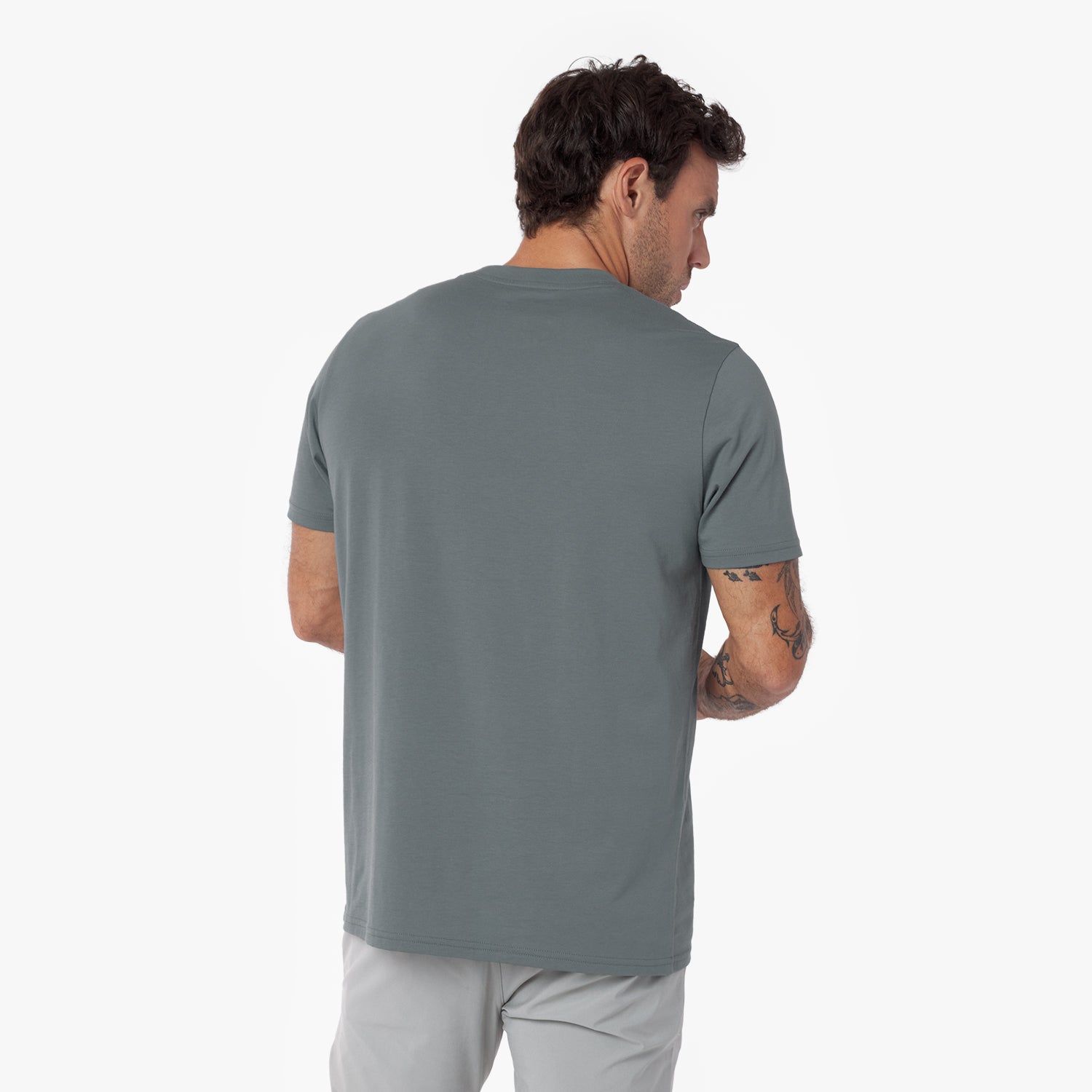 Man wearing a gray t-shirt on a white background