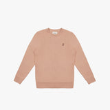 A dusty rose-colored crewneck sweatshirt laid flat on a white background. It features long sleeves, ribbed cuffs, and a ribbed hem. A small embroidered logo of a dog in a slightly darker shade is positioned on the left chest area. The neckline includes a white label with black text displaying the brand "JAMES BARK." The fabric appears soft and comfortable.