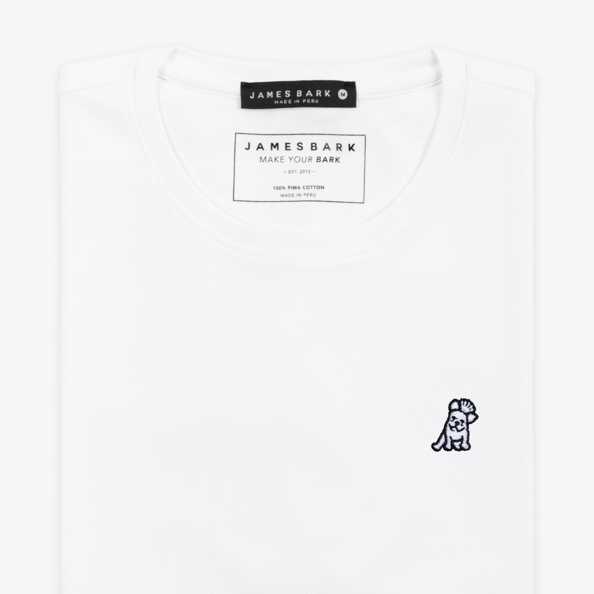 A white T-shirt laid flat against a white background, showing the front side with a small embroidered logo.