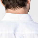 Back view of the collar of the white button-up shirt: A close-up image showing the back of the shirt’s collar, emphasizing the button-down detail.